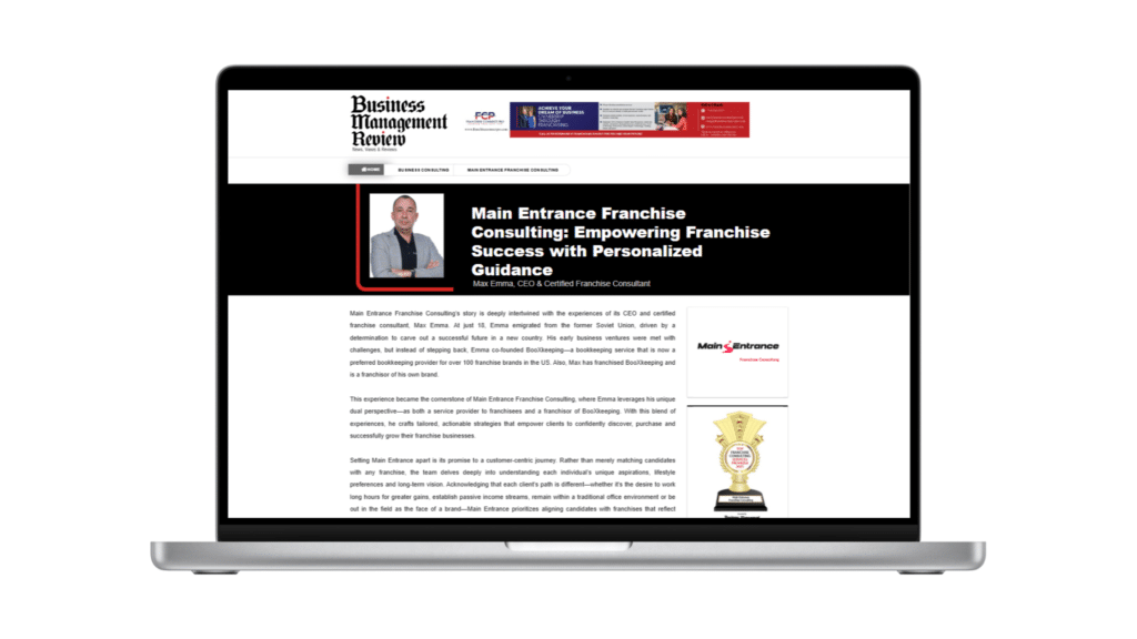 A laptop displaying the business management review magazine article featuring main entrance franchise consulting. The article headline reads 'main entrance franchise consulting: empowering franchise success with personalized guidance' alongside a photo of max emma, ceo & certified franchise consultant.